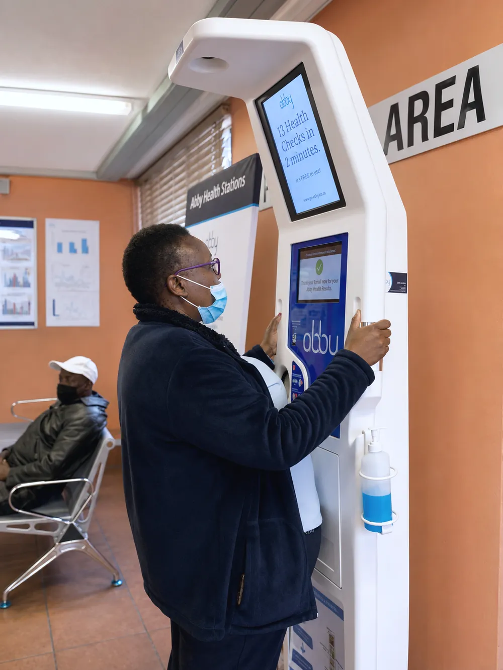 A person using an Abby Health Station in a clinic